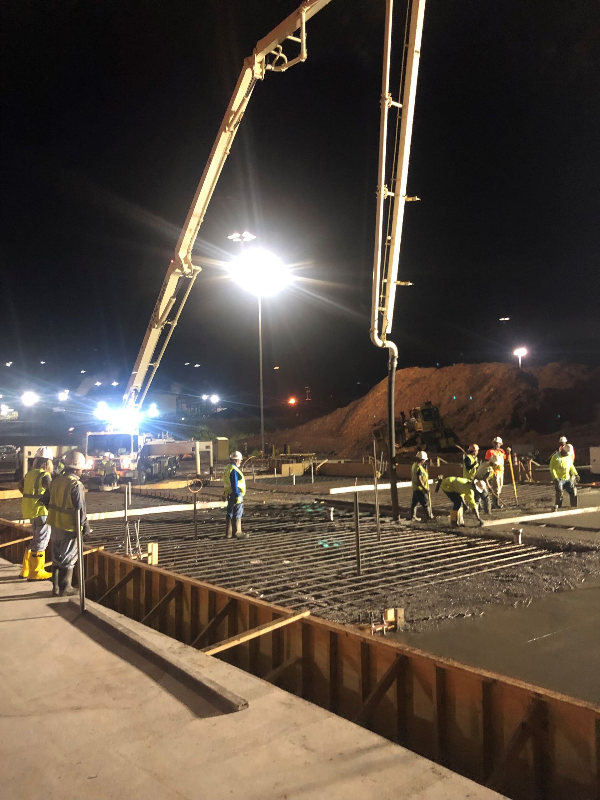 A Group of Construction Workers are Working on a Construction Site at Night | Tallapoosa, GA | Taylor-Made Pumping