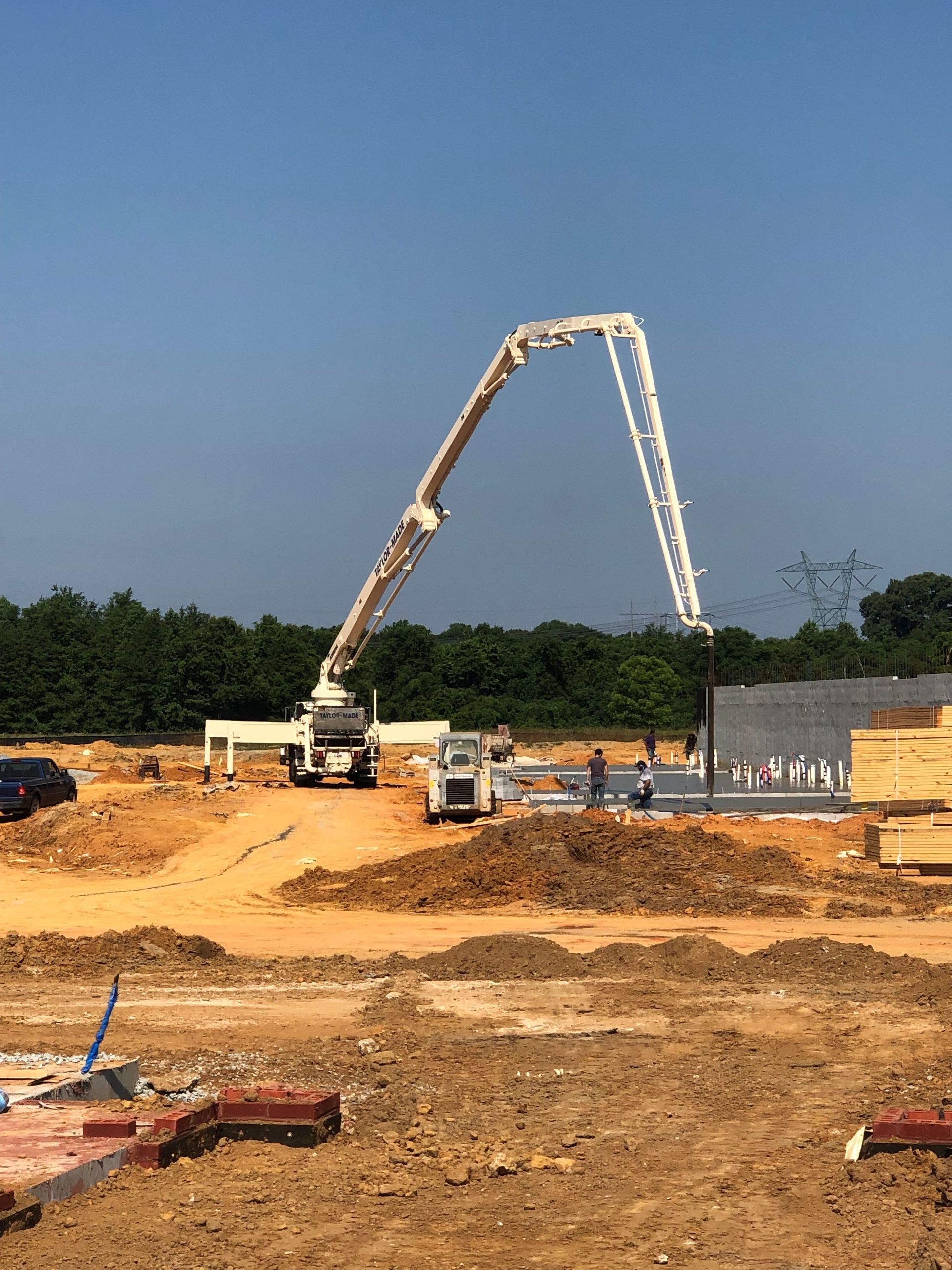 A Concrete Pump is being used to pour Concrete on a Construction Site | Tallapoosa, GA | Taylor-Made Pumping