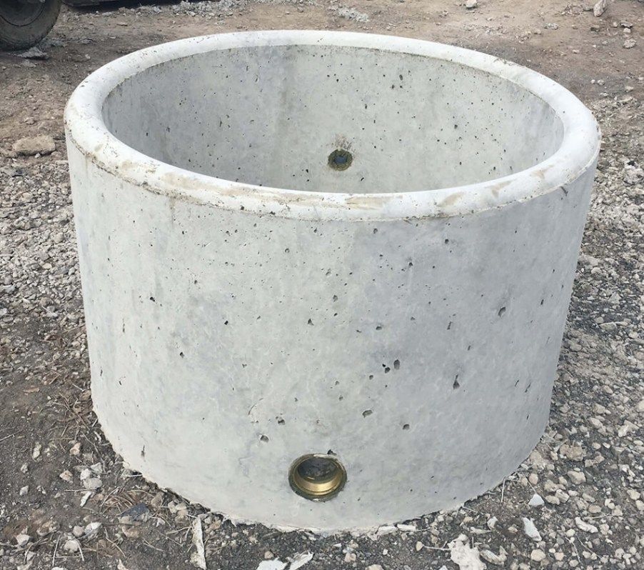 A Large Concrete Ring with A Hole in The Middle — Hazells Farm & Fertilizer Services in Taminda, NSW