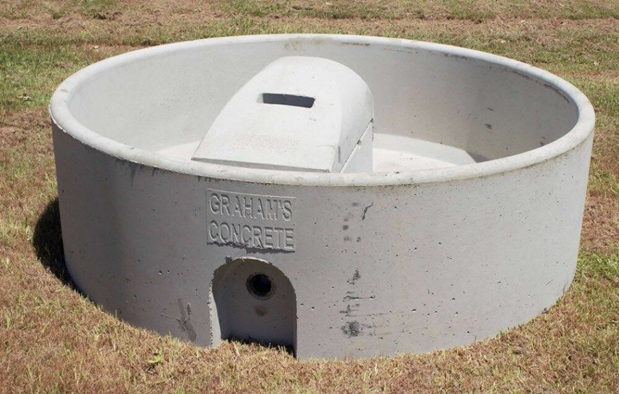 A Group of Stainless Steel Water Tanks Are Sitting on Top of A Roof — Hazells Farm & Fertilizer Services in Taminda, NSW