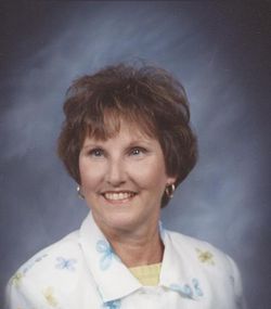 a woman wearing a black shirt and blue jeans is standing in a circle .