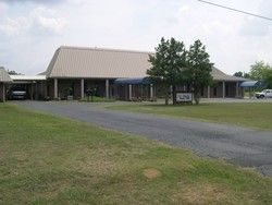 a large building with a car parked in front of it .