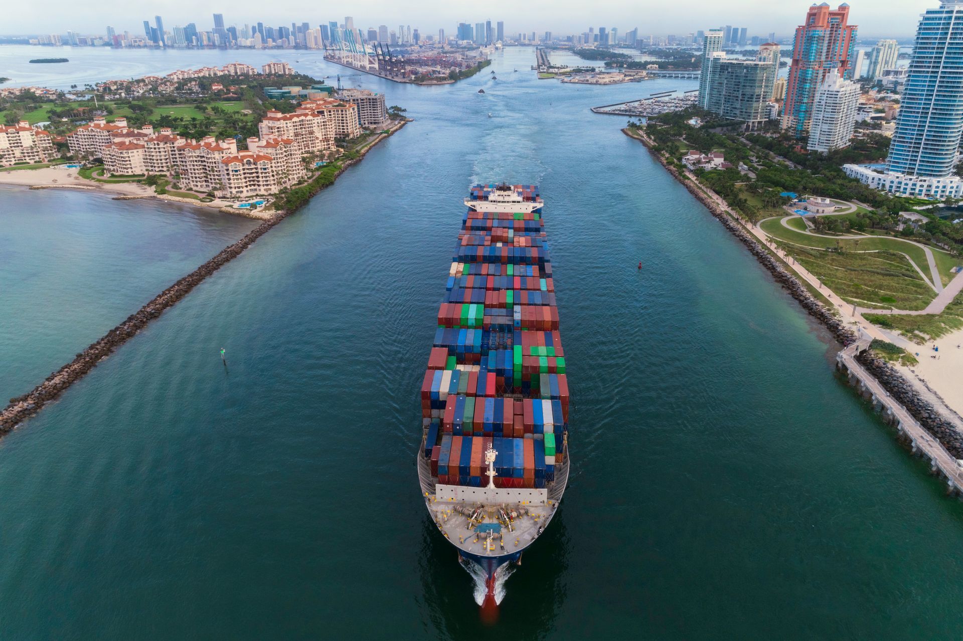 An aerial view of a large container ship floating on top of a body of water.