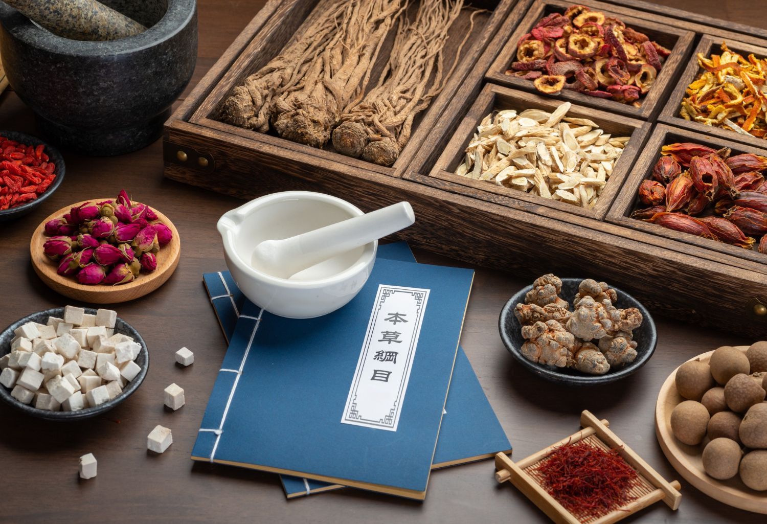 There are many different types of chinese herbs on the table.