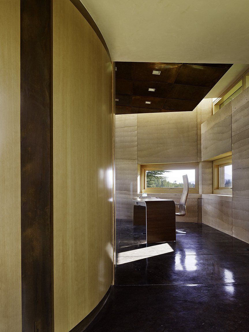 Entering modern office with rammed earth SIREWALL