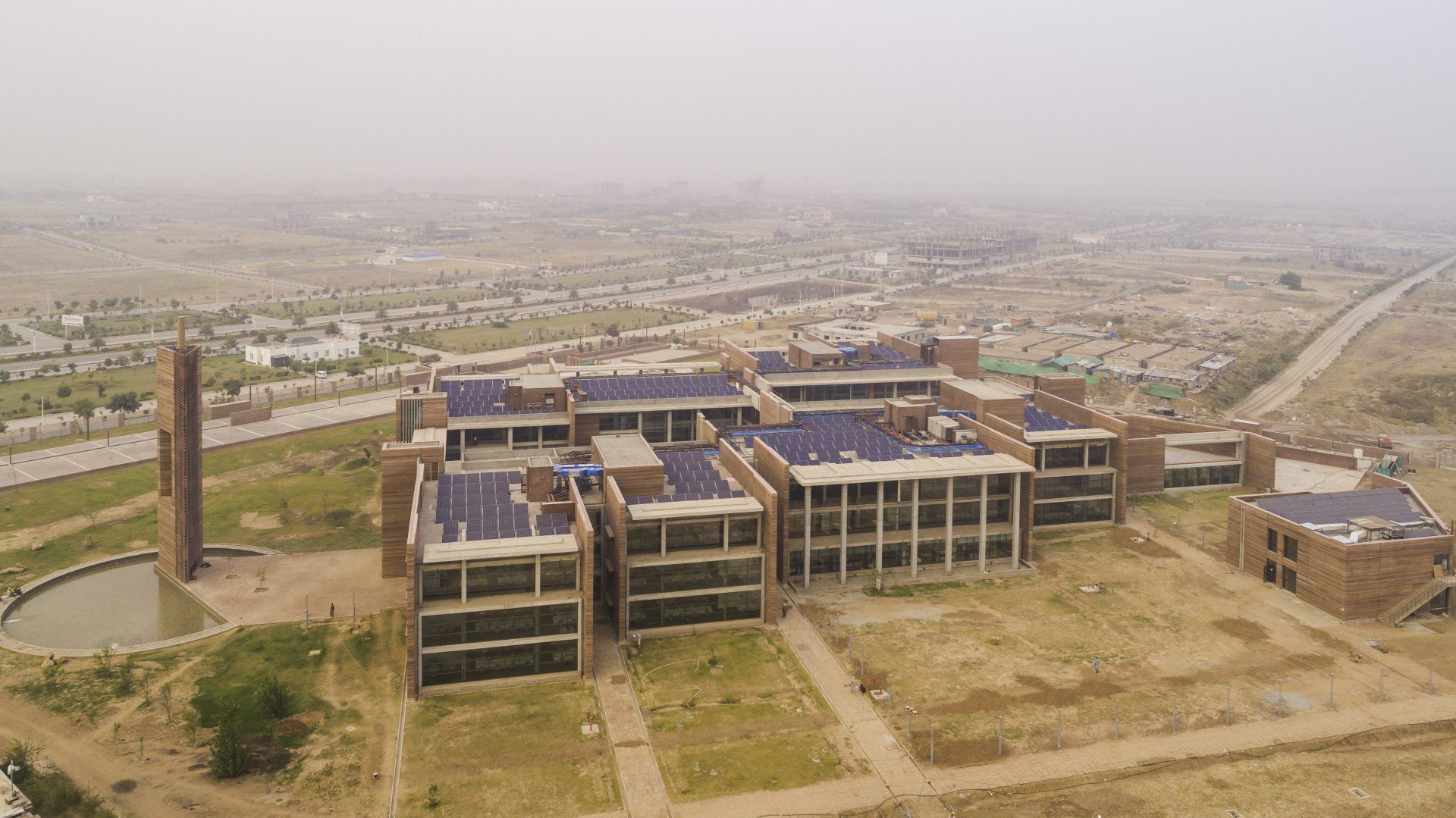 areal view of Telenor Tower complex showing solar panels on the roofs