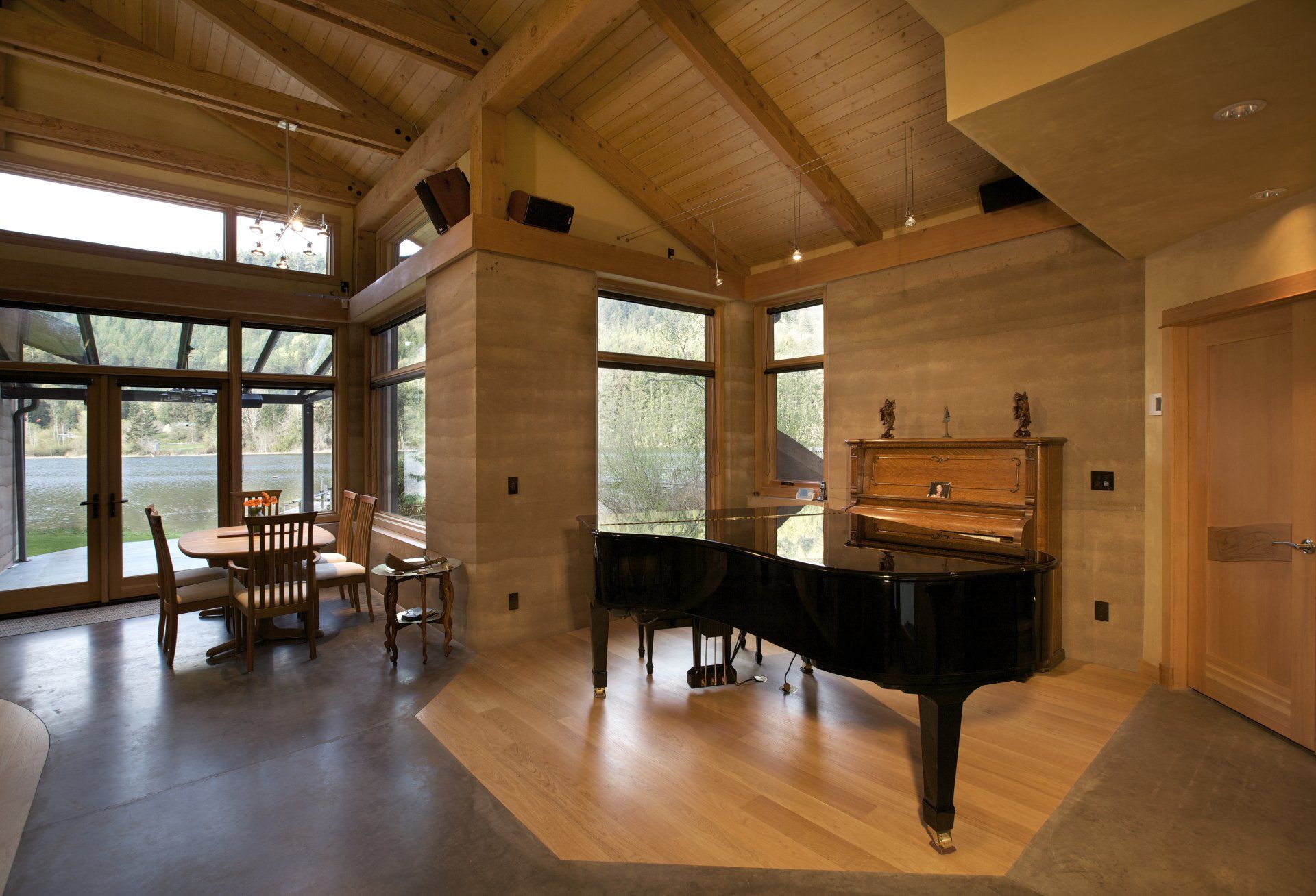 livingroom with  grand piano, high wooden ceilings, and SIREWALLs