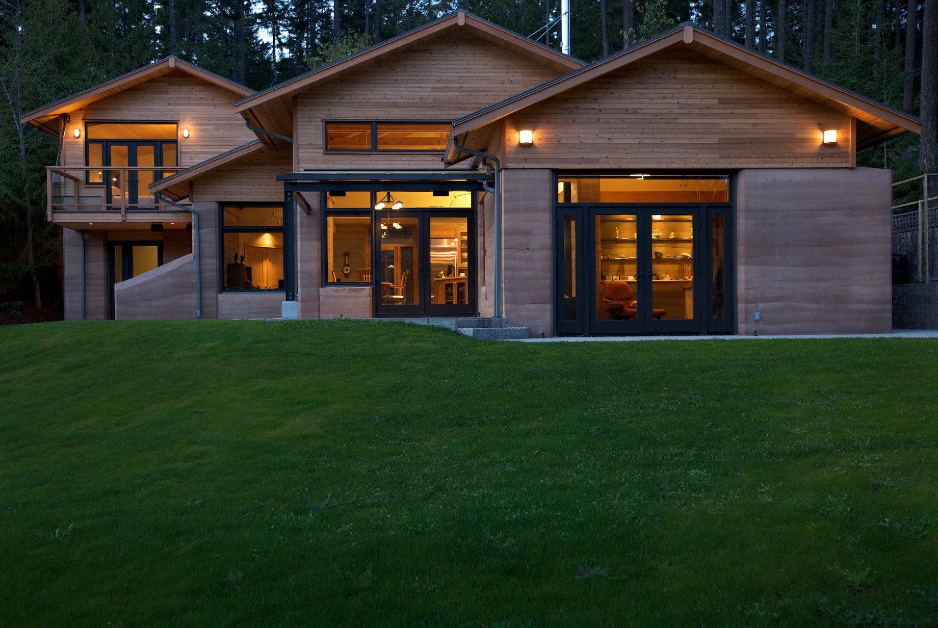 Grierson house exterior with pointed roof line and large, green front yard
