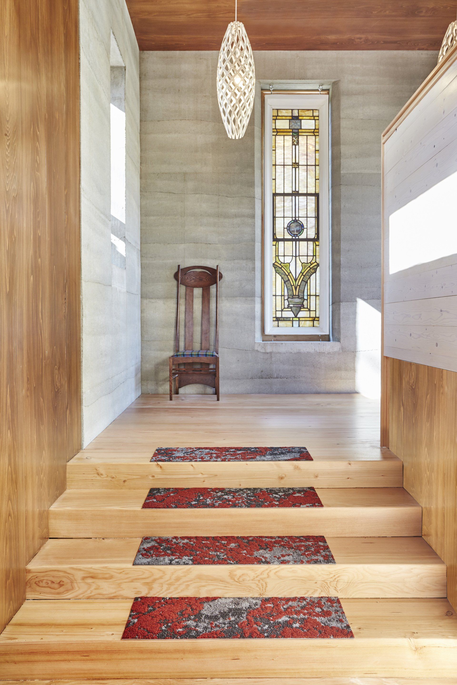 wooden stairs leading to hallway with SIREWALL