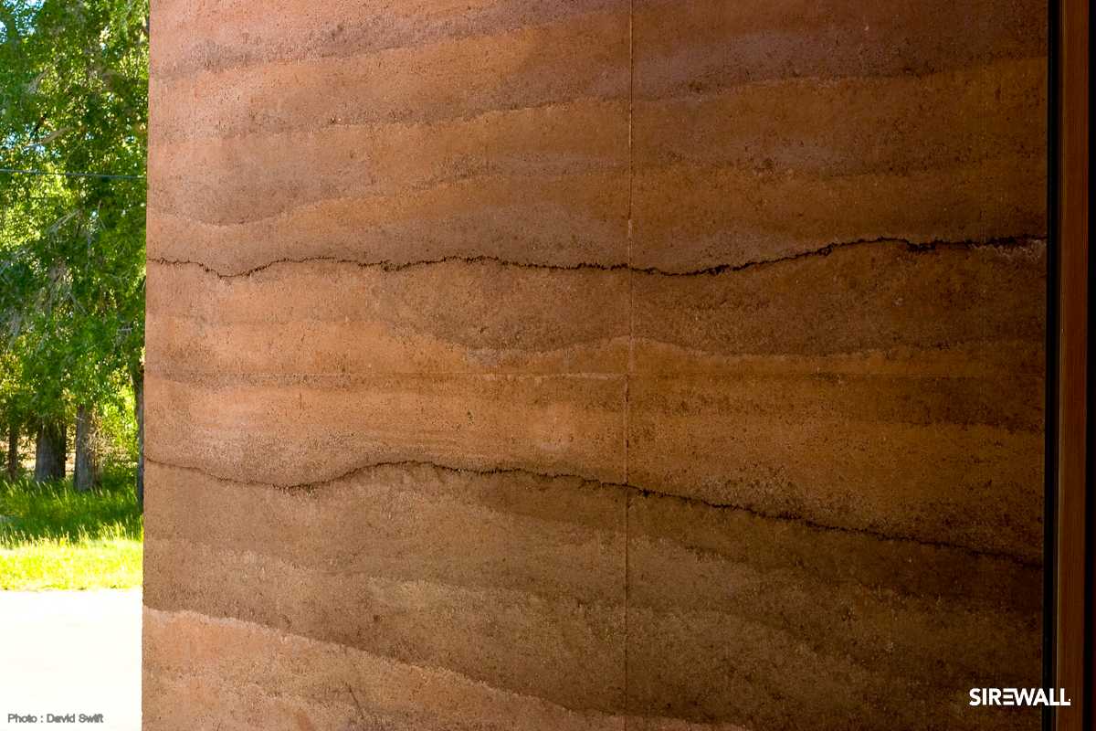 exterior rammed earth SIREWALL with understated color variations