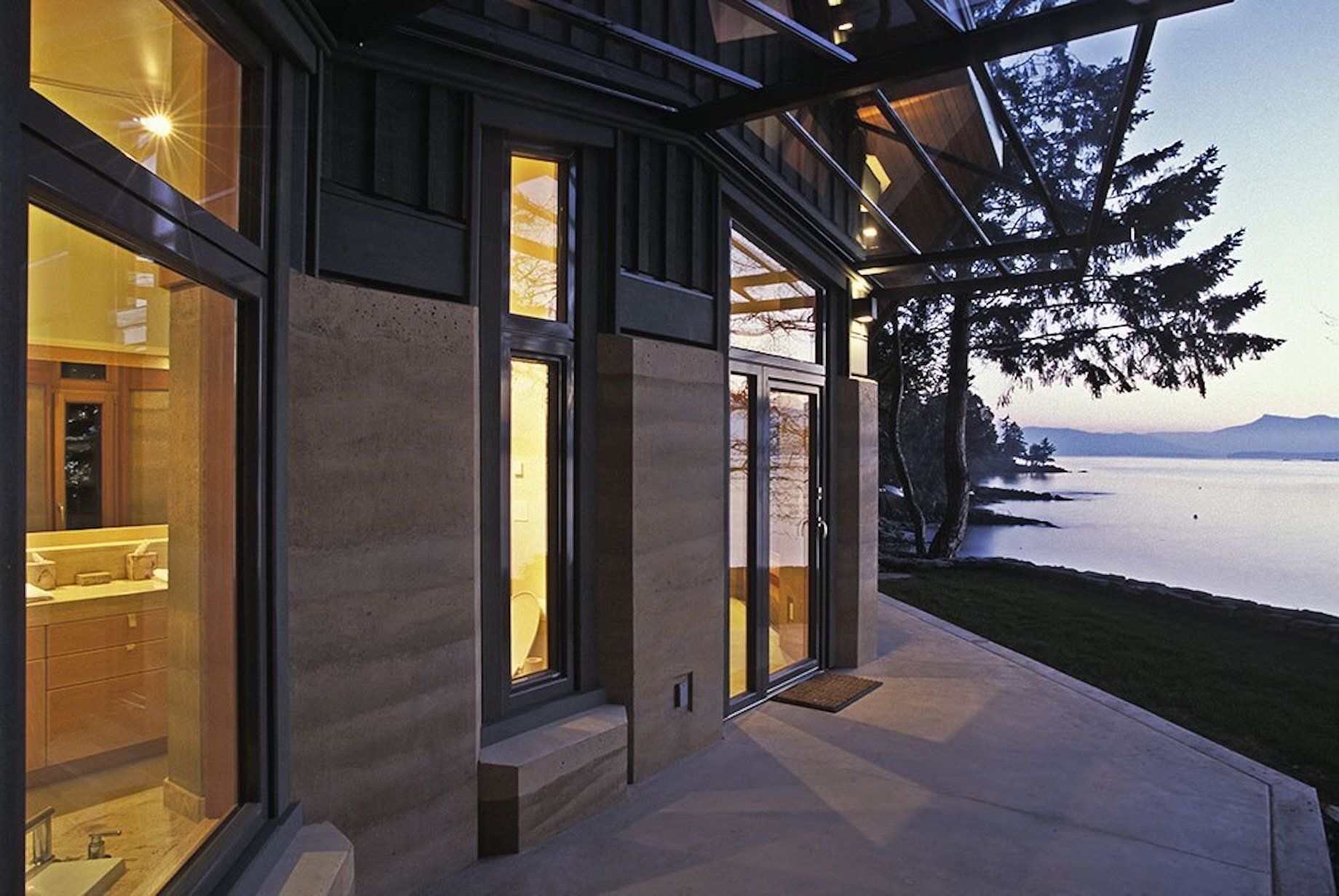 otter limits patio at twilight with lake in the background