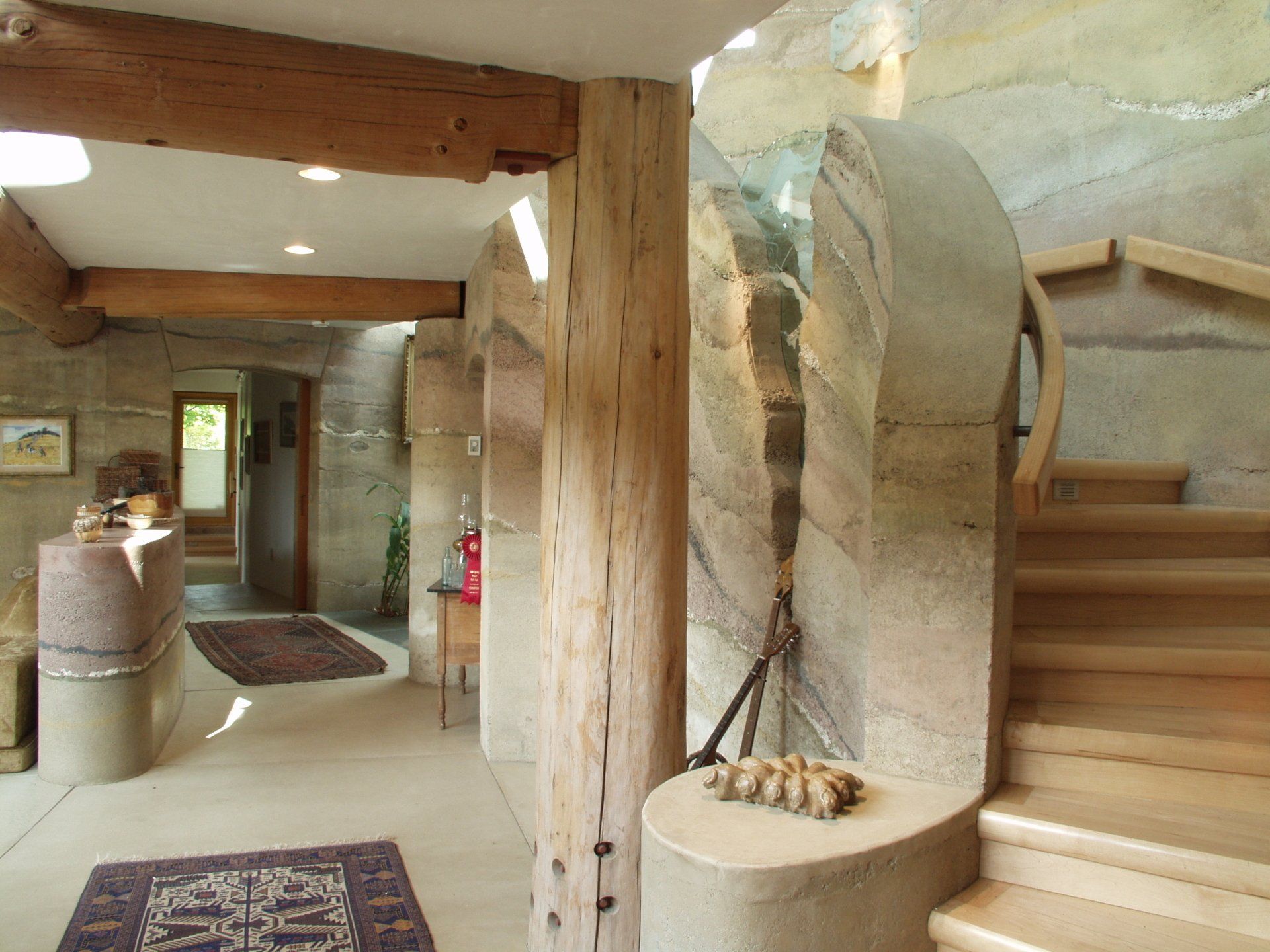 rammed earth stairway, walls, and room divider