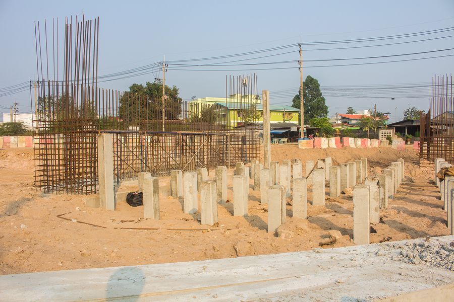 a construction site with a lot of concrete pillars