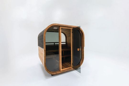 Small round wooden cabin pod with glass doors and windows, shown on a white background.