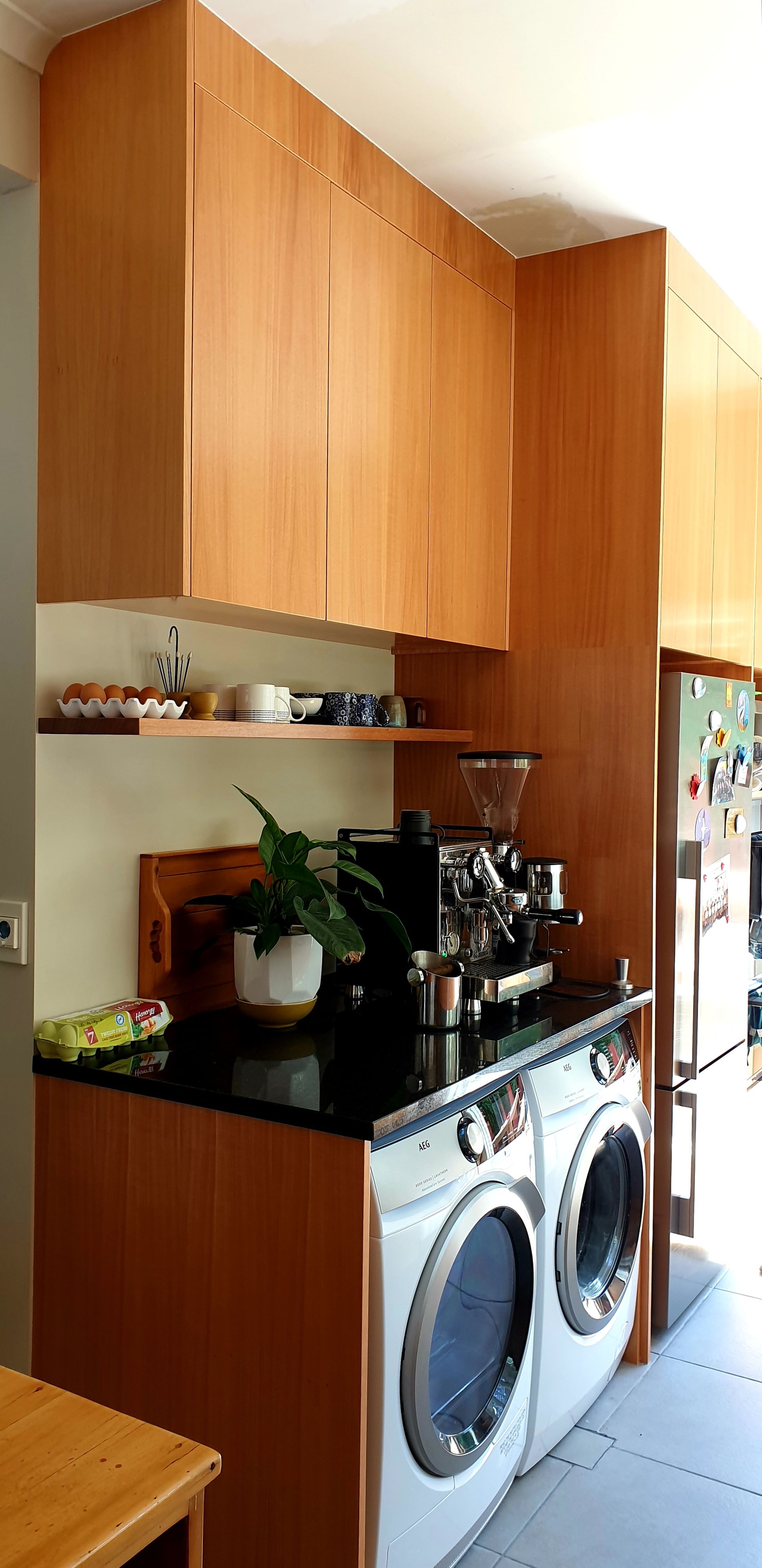 A kitchen with a washer and dryer in it