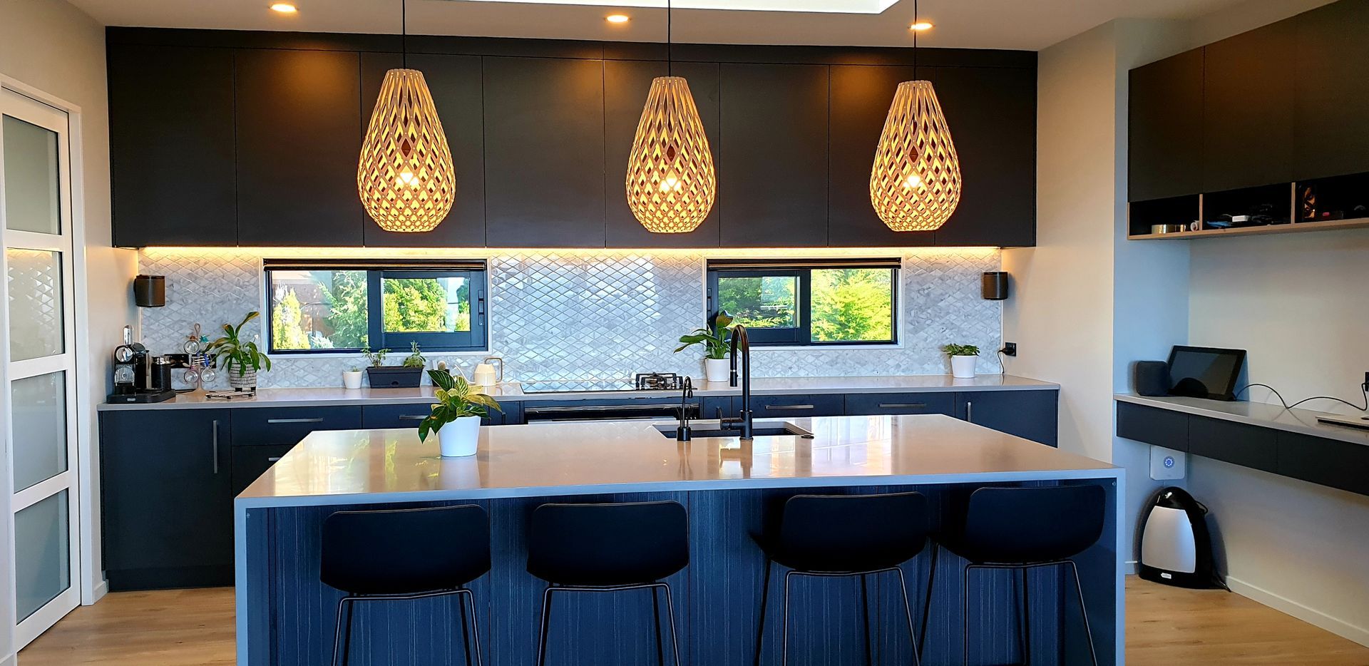 A kitchen with a large island in the middle of the room.