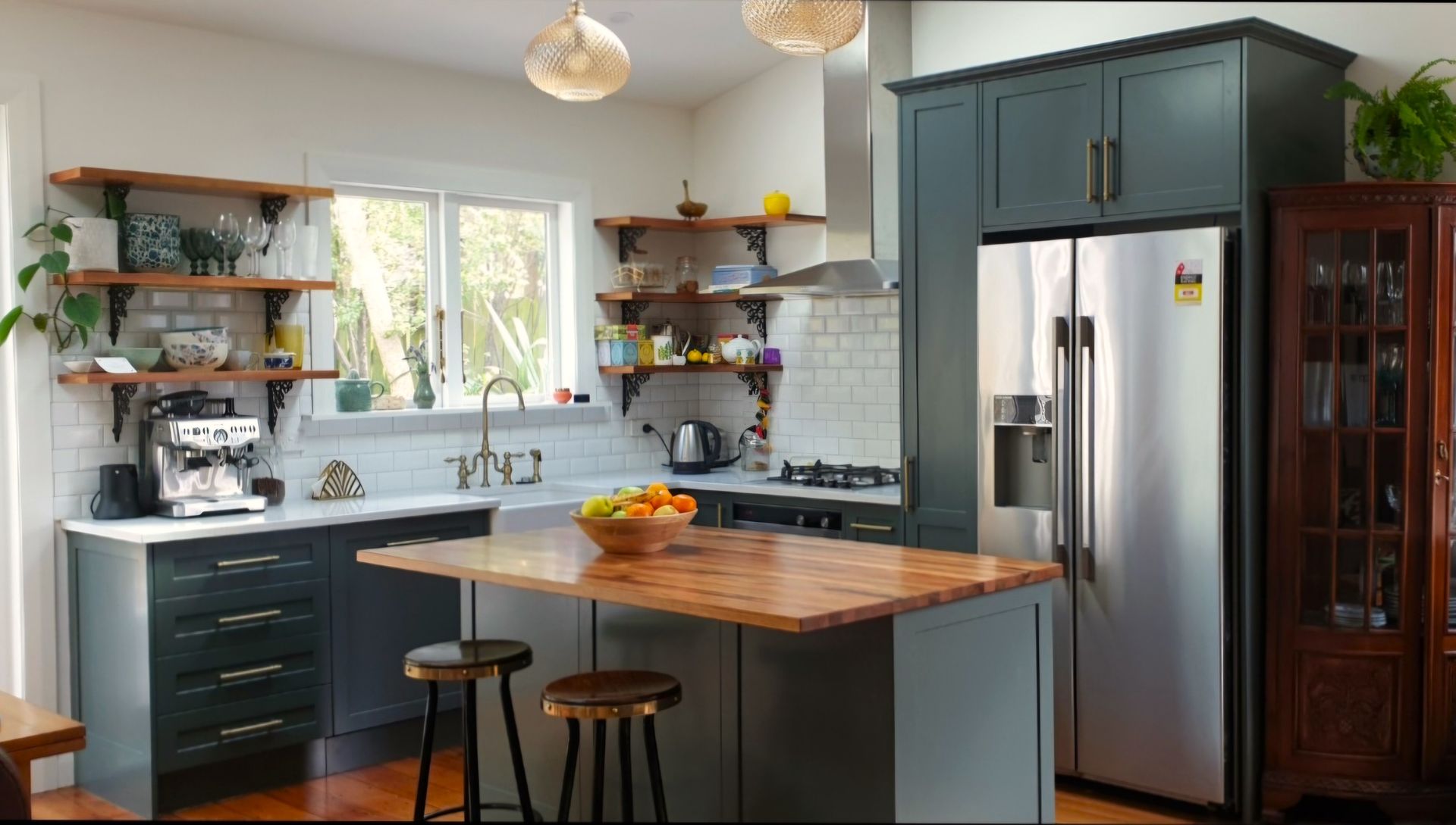 A kitchen with stainless steel appliances and a wooden counter top.