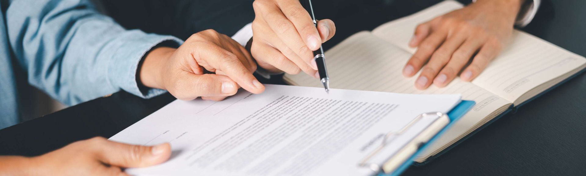 Two people review an insurance plan.