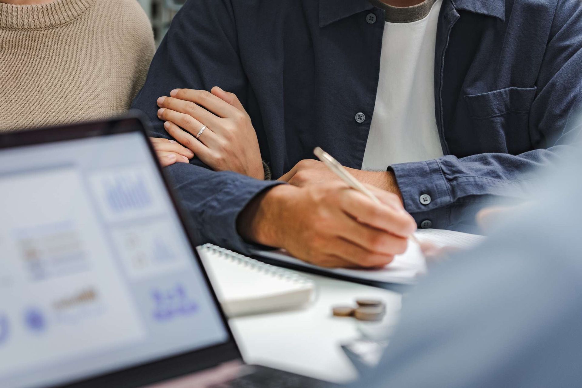 A married couple consults with a financial advisor.