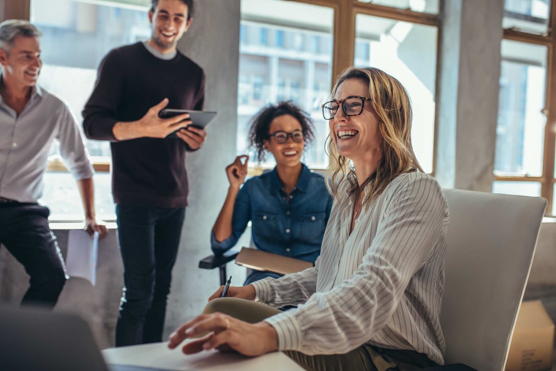 Cheerful business team during a meeting at a startup office