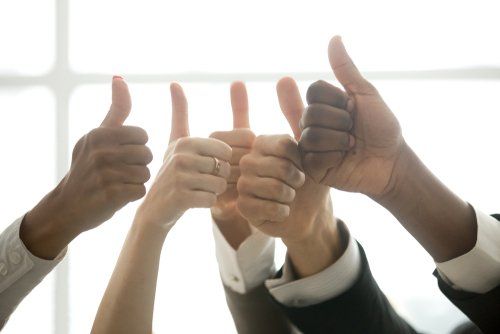 Marketing professionals giving a thumbs up