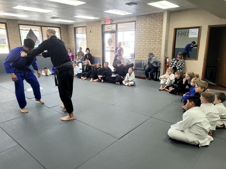 Mineral Wells Jiu Jitsu Instructors showing Heart and Dagger Kid's martial arts class a. new technique.