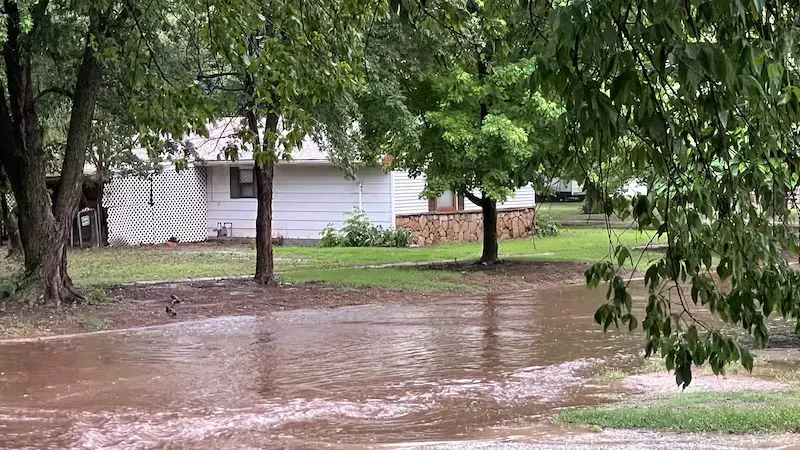 Water flooding at end of residential driveway in the streets of Wichita Kansas