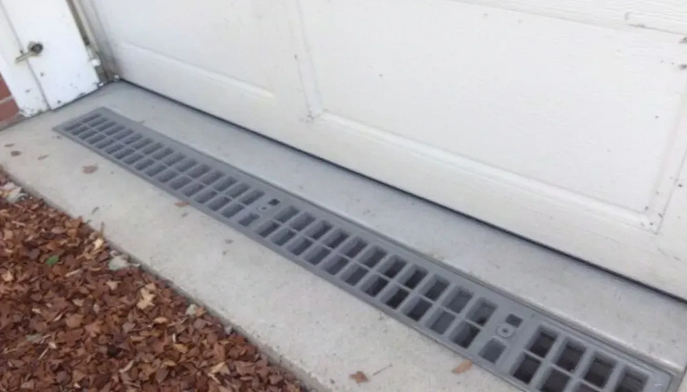 Close up of a trench drain along a garage door in Wichita