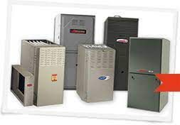 A group of air conditioners are sitting next to each other on a white surface.