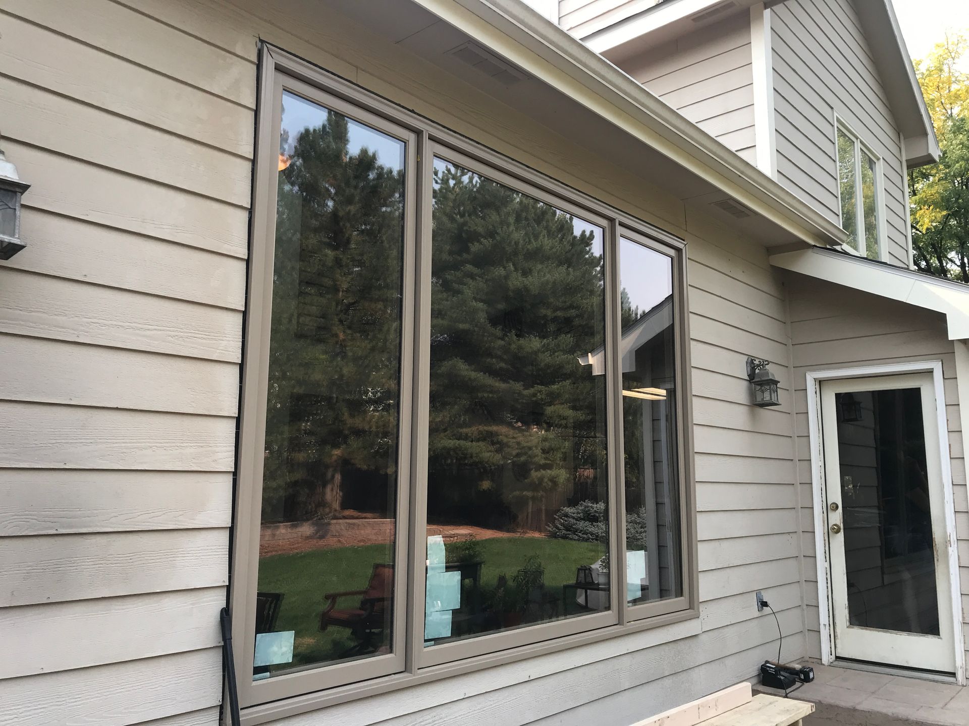 A house with a large window on the side of it