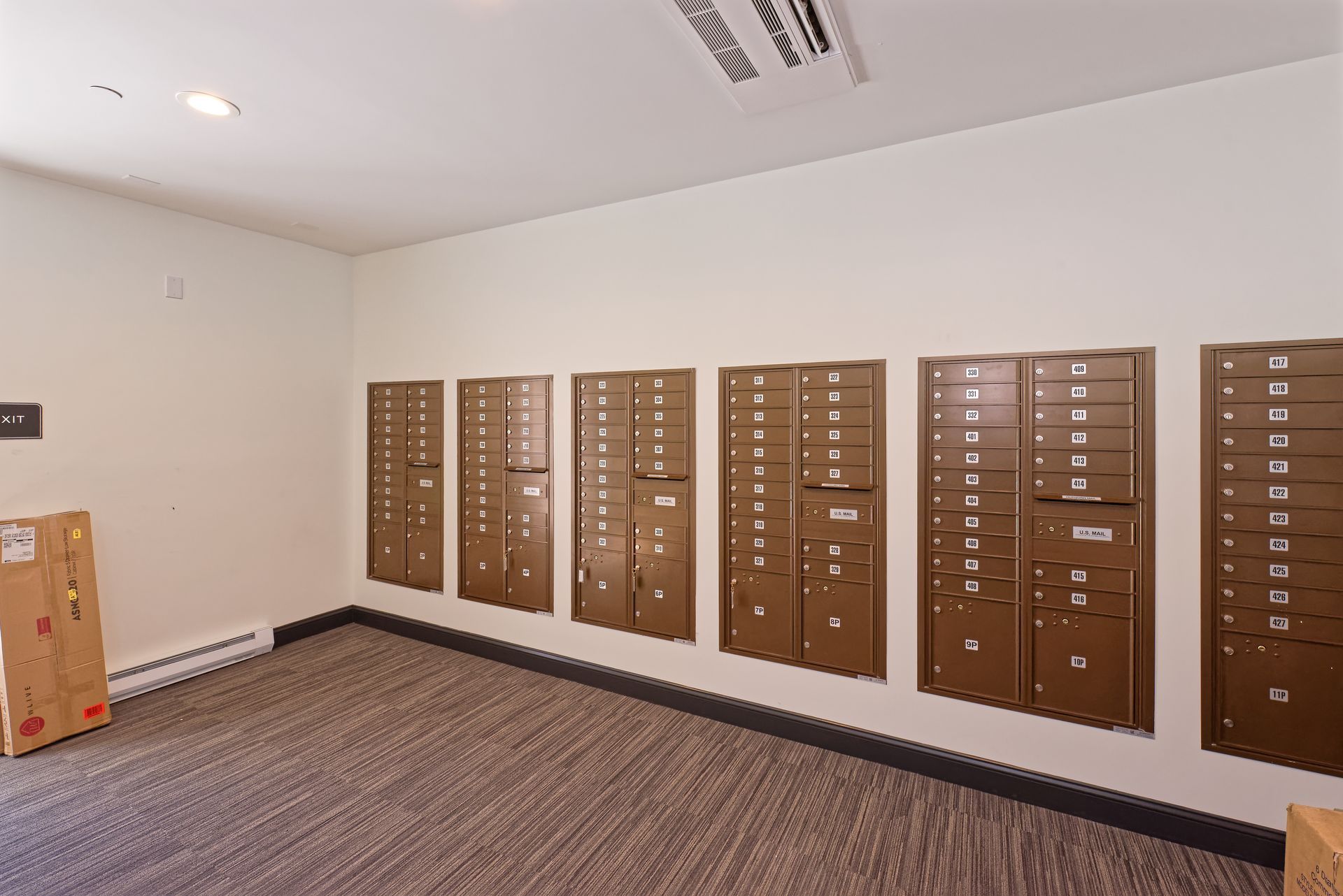 a room with a lot of mailboxes on the wall