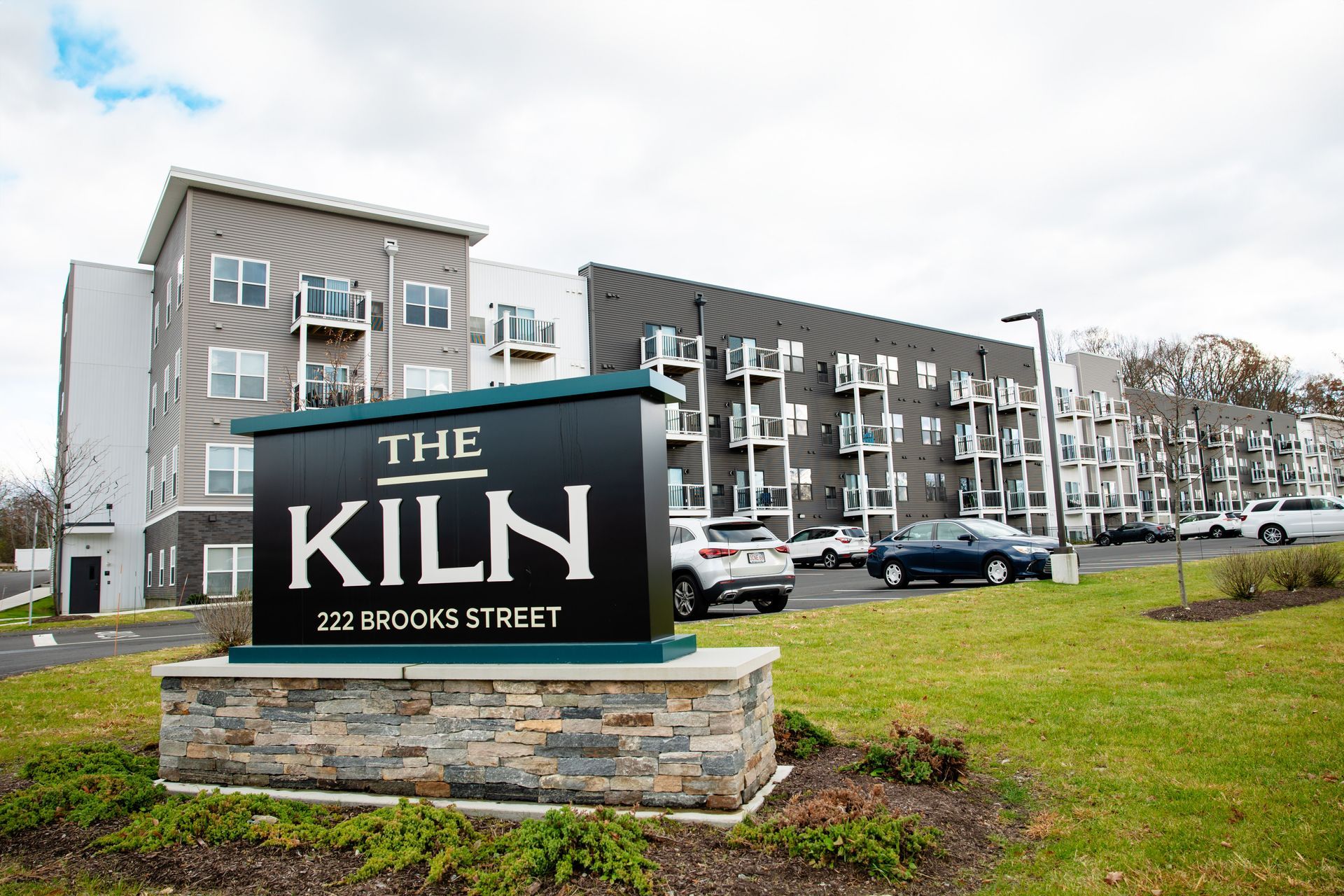 an aerial view of a building and a parking lot in a city .