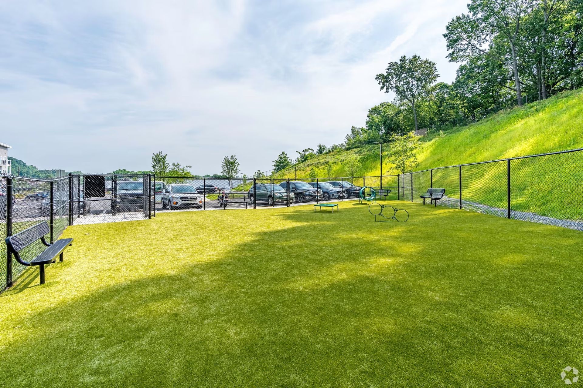 a park with a fence and a bench in the middle of it .
