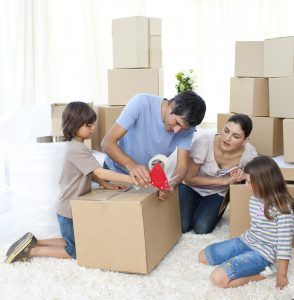 family unpacking boxes