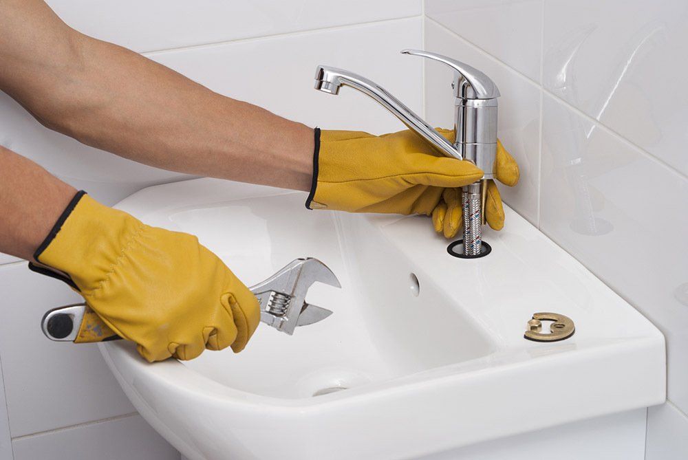 Fixing The Faucet — Beloit, WI — Quigley-Smart, Inc.