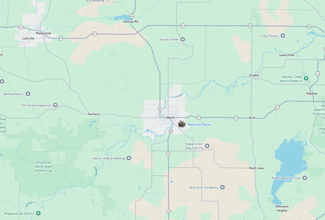 A digital map showing roads and geographic features, with a central urban area and a body of water in the lower right.