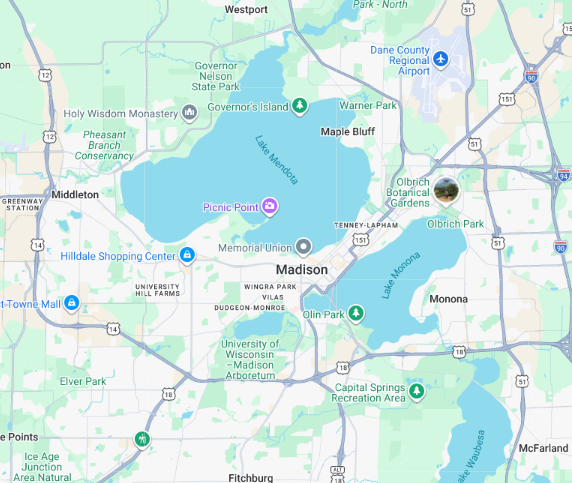 A map showing the city of Madison, Wisconsin, highlighting Lakes Mendota and Monona, surrounding roads, and landmarks.