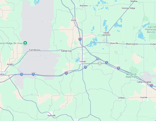 Digital map showing highway intersections and regional roads in the Tomah, Wisconsin area.