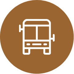 An icon of a bus in a brown circle.
