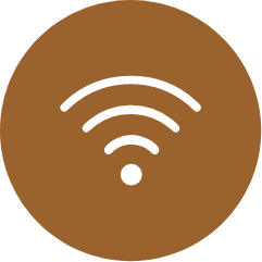 A brown circle with a white icon of a wifi signal inside of it.