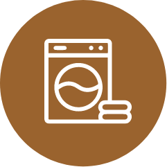An icon of a washing machine and towels in a brown circle.