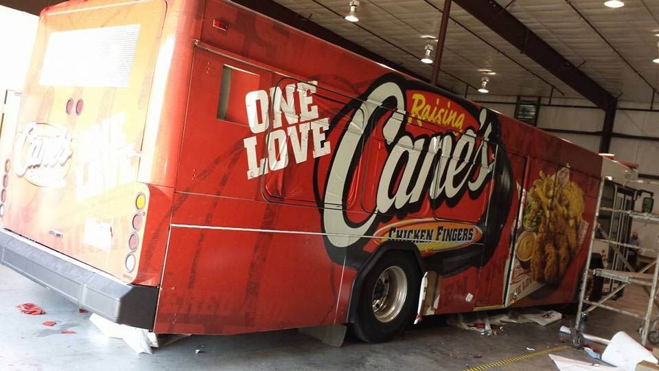 A red food truck with the words one love cane 's on it