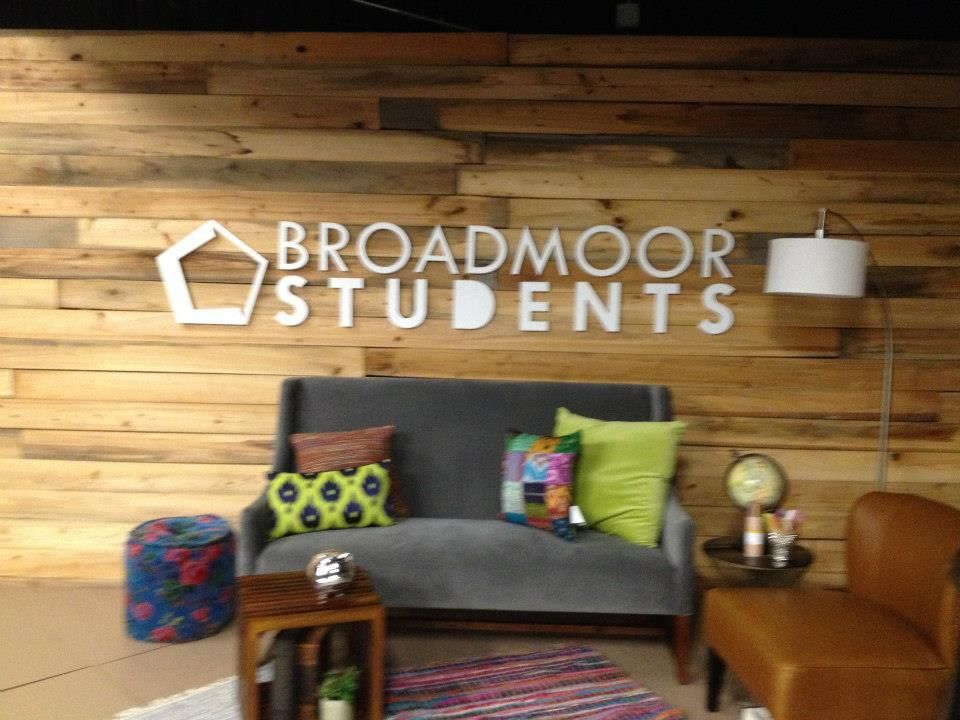 A wooden wall with broadmoor students written on it