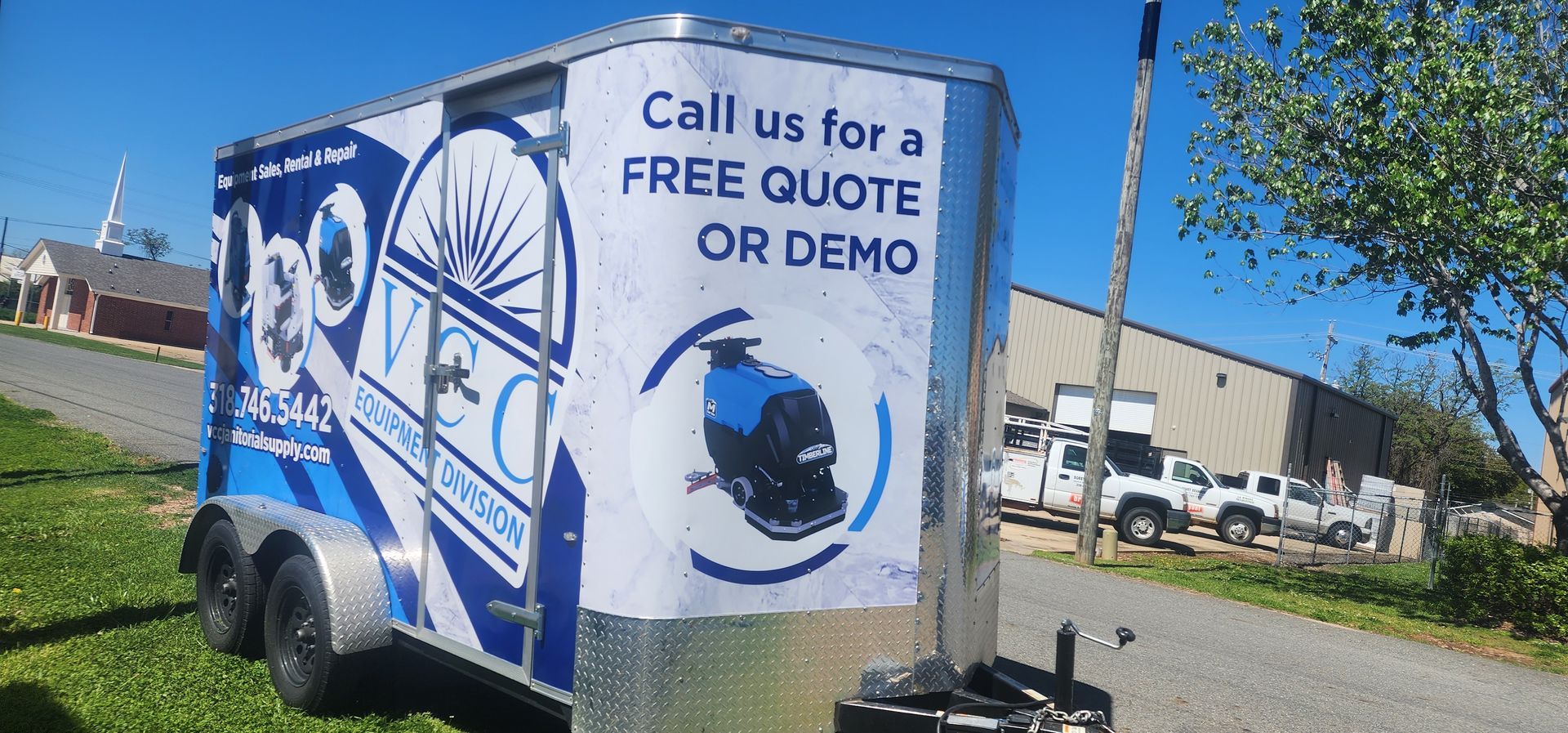 A trailer with a sign that says call us for a free quote or demo