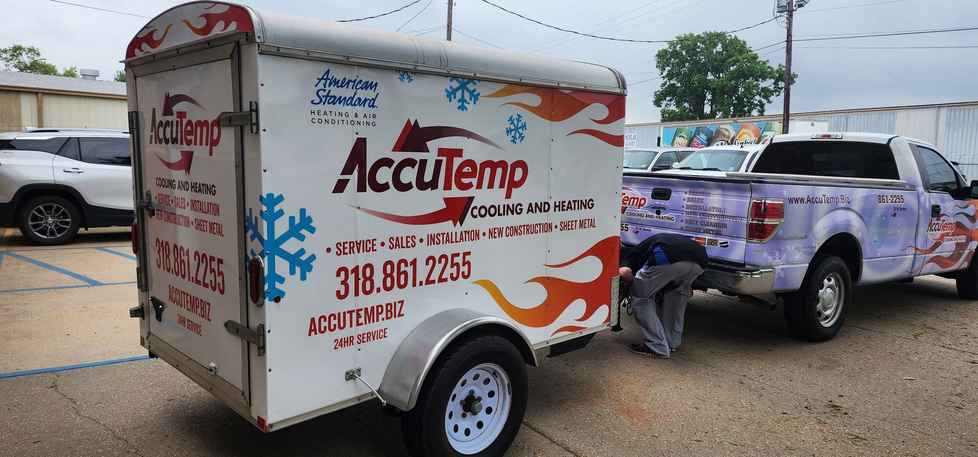A truck with a trailer attached to it that says accutemp