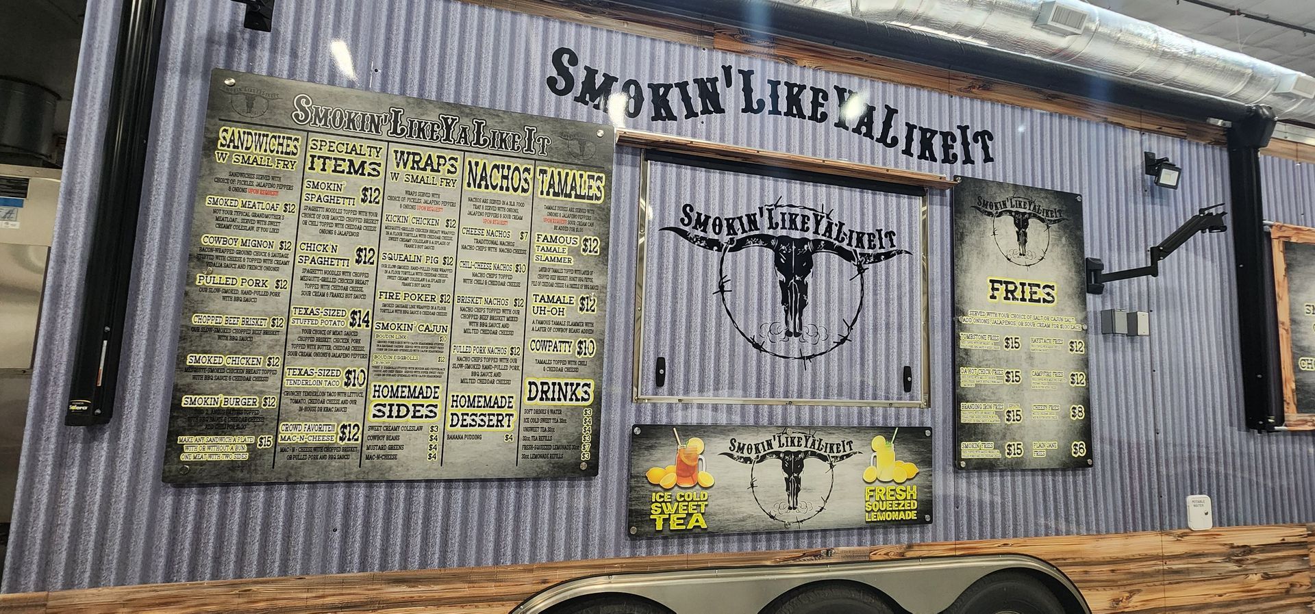 A restaurant with a menu on the wall.