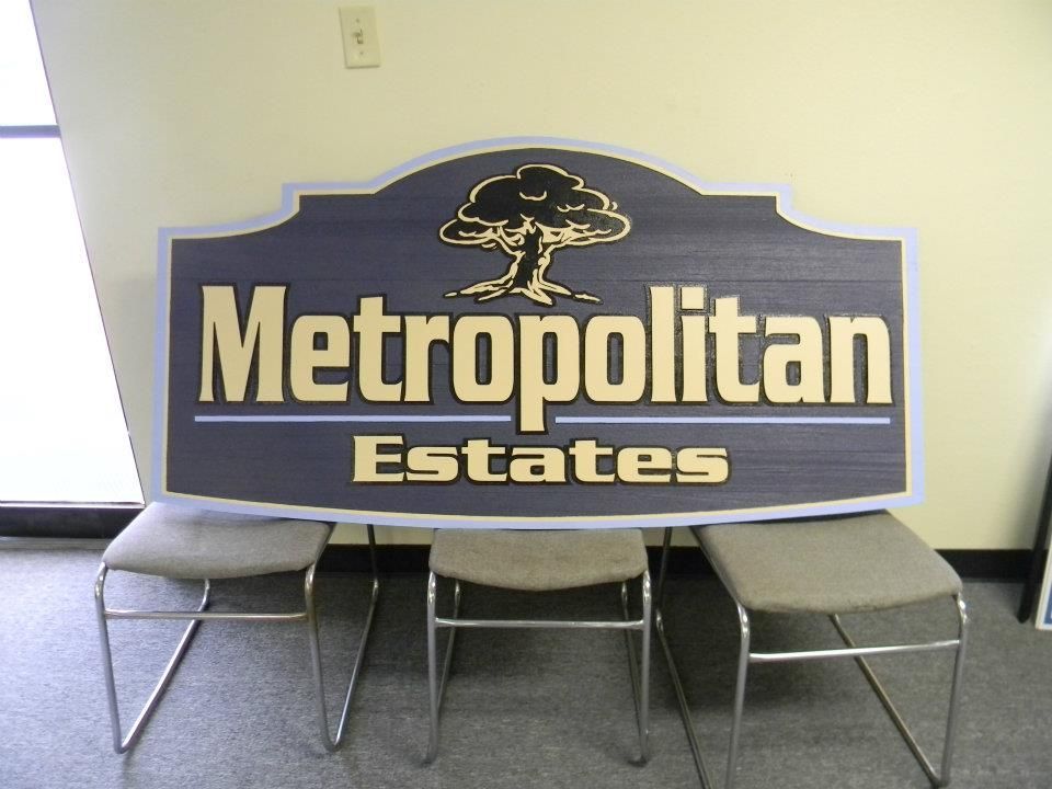 A sign for metropolitan estates sits on a chair