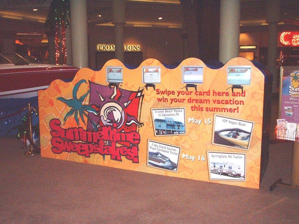 A sign that says swipe your card here and win your dream vacation this summer
