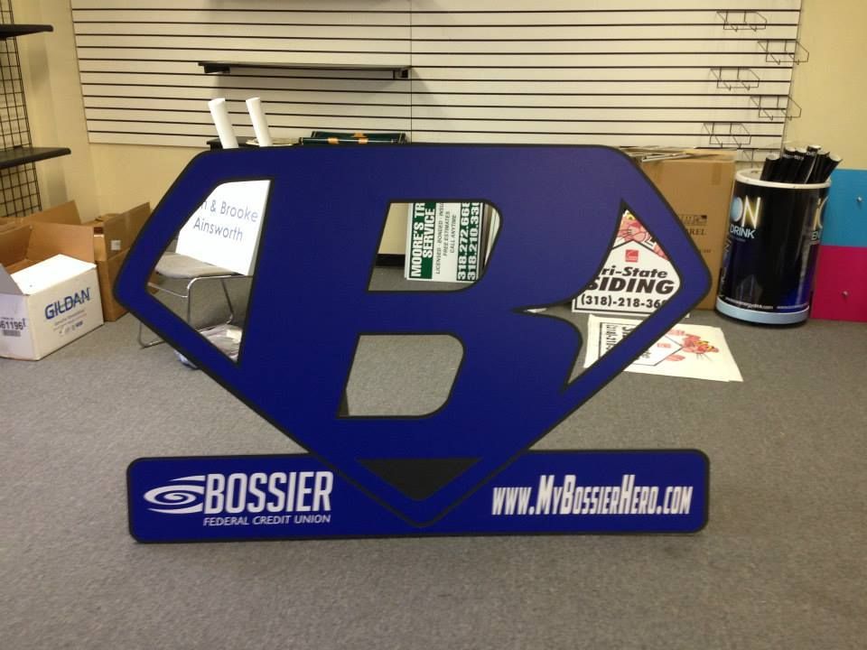 A sign that says bossier on it in a room