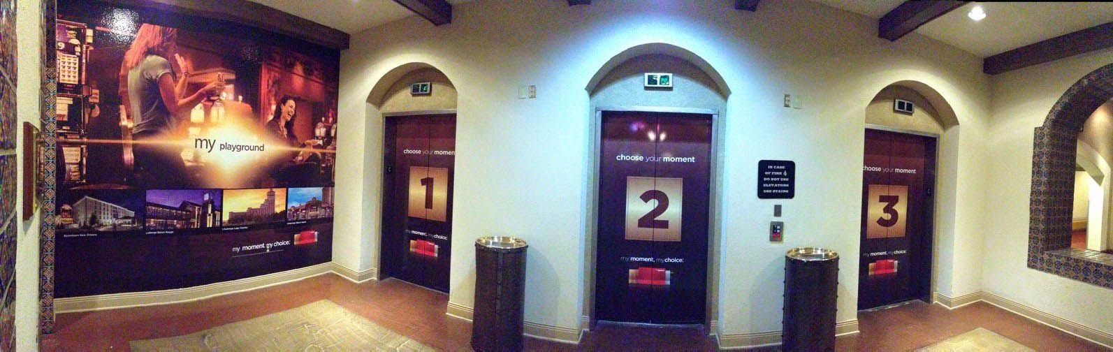 A hallway with elevators numbered 1 2 and 3
